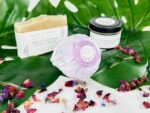Relaxing spa gift set including a moisturizing bath bomb, an exfoliating soap and a soy candle