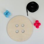 Button Lacing and Pompom Push Activity