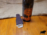 Leather covered bottle opener