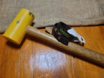 Brown leather bracelet with cross stitched design