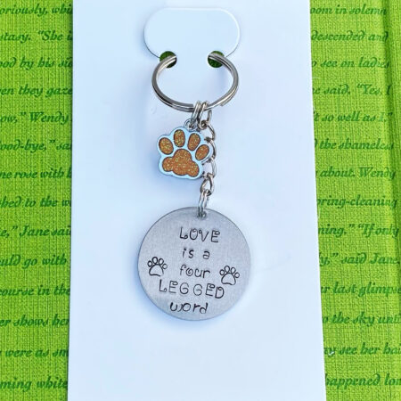 ‘love is a four legged word’ hand stamped keychain