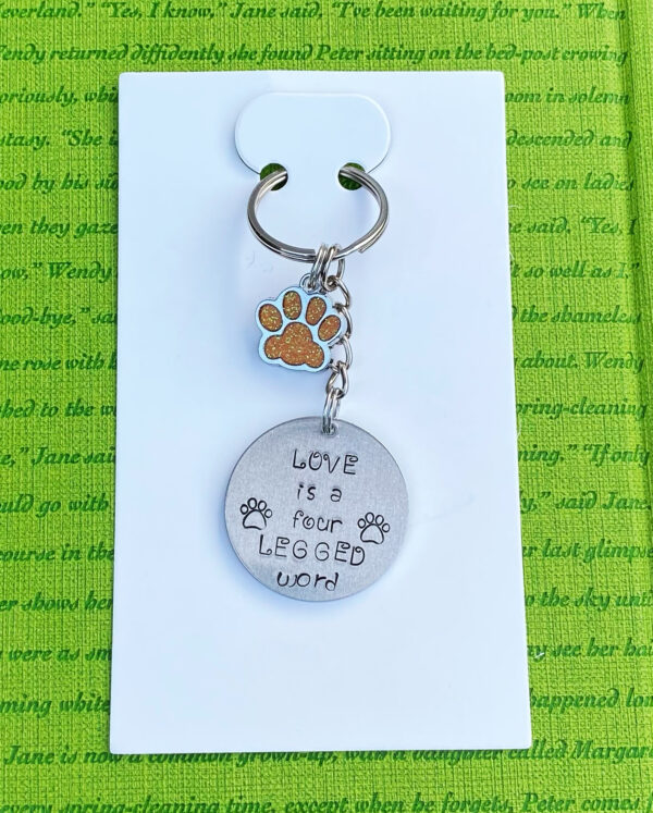 ‘love is a four legged word’ hand stamped keychain