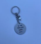 ‘in my spooky mom era’ hand stamped keychain