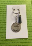 ‘adventure awaits’ hand stamped keychain
