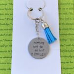 ‘nothing left to do but smile’ hand stamped keychain