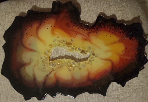 Firelight Resin geode slice with center ring of crystals-stand included