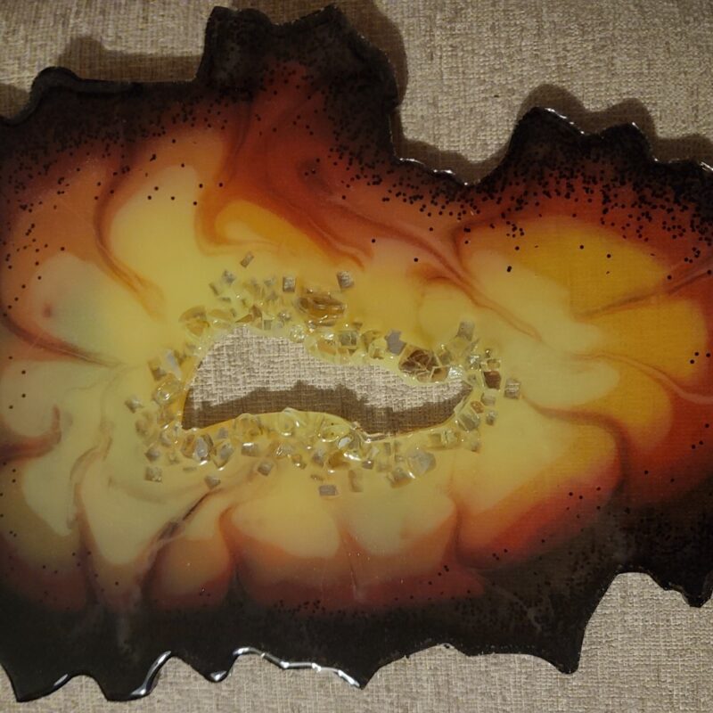 Firelight Resin geode slice with center ring of crystals-stand included