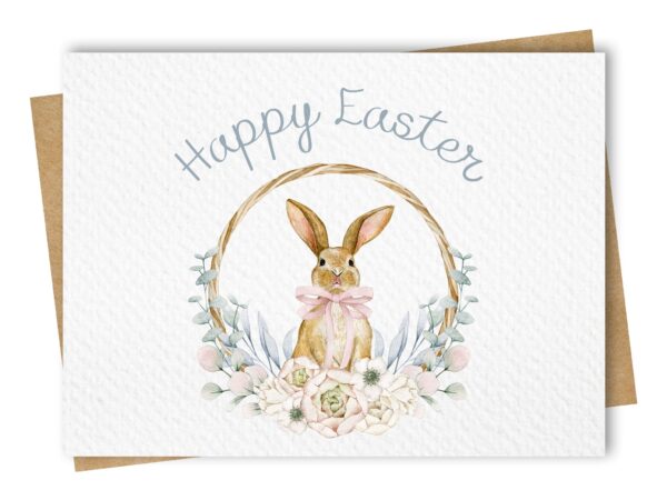 Paper Kuts - An Easter card with a watercolour floral wreath surrounding an adorable bunny