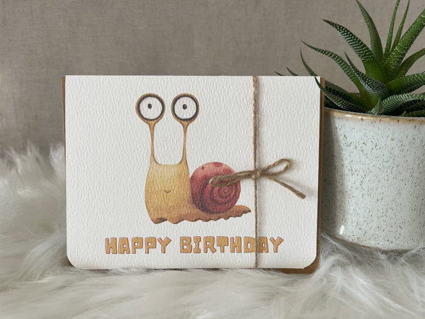 Birthday greeting card showcasing a quirky watercolour snail