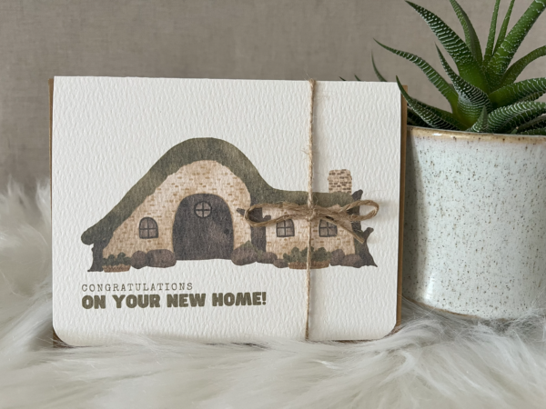 New home greeting card including a watercolour hobbit style house