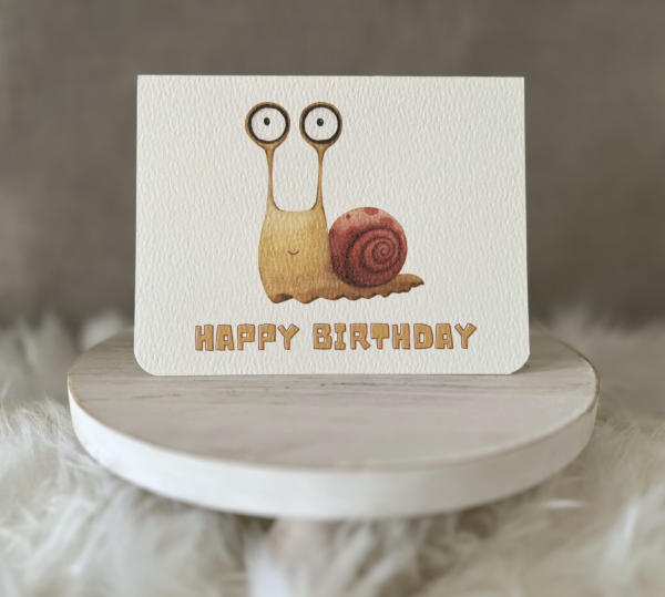 Birthday greeting card showcasing a quirky watercolour snail