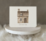 New home greeting card displaying a watercolour stone house