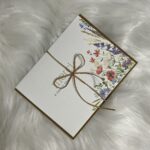 Thank you "Merci" greeting card with a beautiful floral corner
