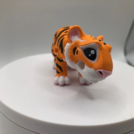 small tiger figure or keychain