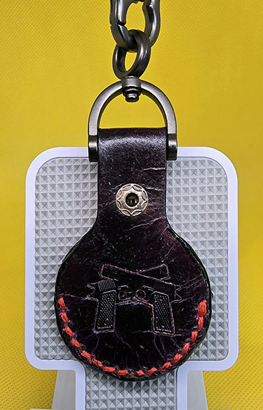 Apple AirTag Holder with Debossed Guns and Red Stitching Handcrafted from Premium Quality Veg-Tanned Leather