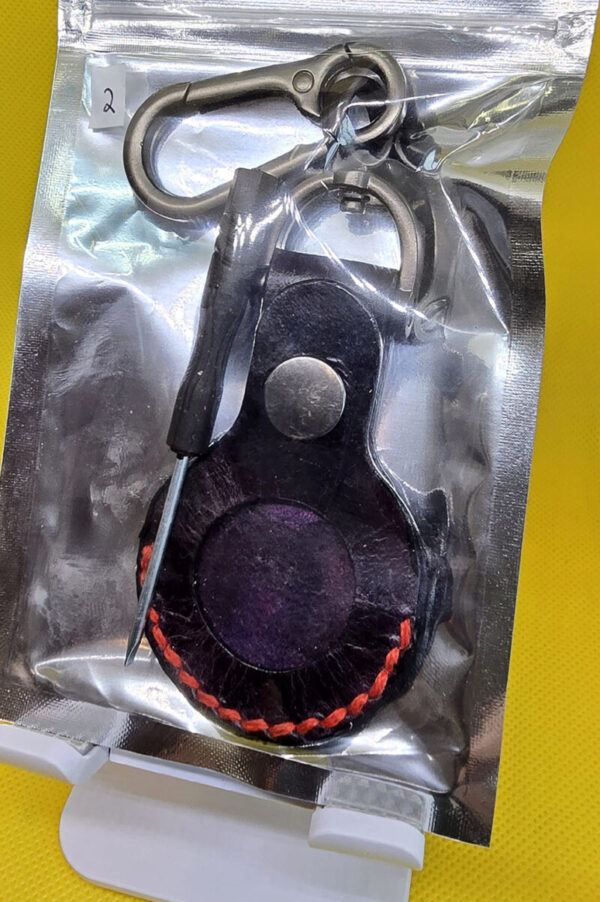 Apple AirTag Holder with Debossed Guns and Red Stitching Handcrafted from Premium Quality Veg-Tanned Leather