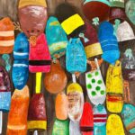 A print of a wall of colorful fishing buoys hanging.