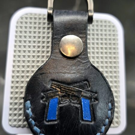 Veg-tanned Leather Apple AirTag Holder with Navy Handled Guns Handcrafted from Premium Quality Veg-Tanned Leather