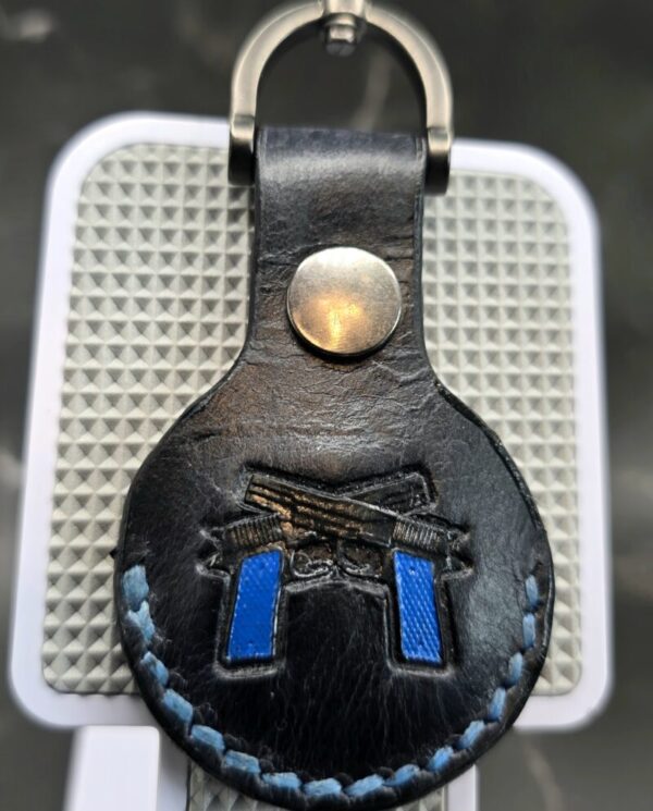 Veg-tanned Leather Apple AirTag Holder with Navy Handled Guns Handcrafted from Premium Quality Veg-Tanned Leather