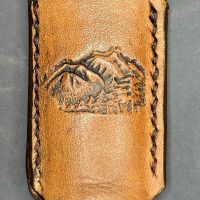 Leather Bic lighter case with debossed mountain scenery
