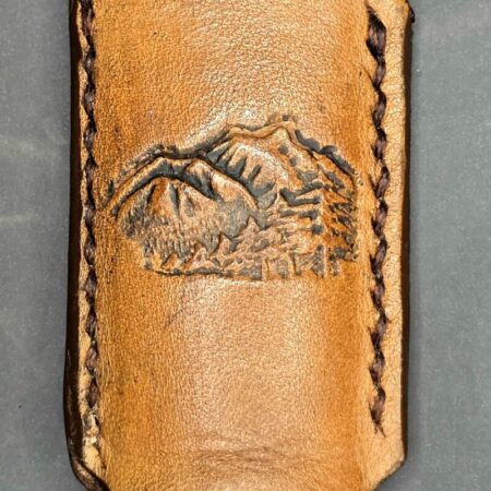 Leather Bic lighter case with debossed mountain scenery