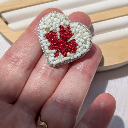 heart-shaped-pin-canadian-flag-hand