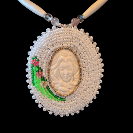 close up of beadwork on mother earth medallion