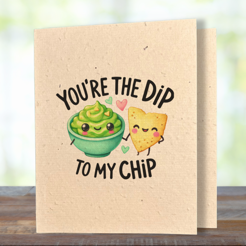 plantable greeting card, natural coloured paper, embedded with wildflower seeds, an image in kawaii style of bowl of guacamole and a nacho chip, the sentiment you're the dip to my chip
