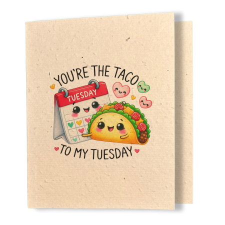 plantable greeting card, natural coloured paper, embedded with wildflower seeds, an image in kawaii style of a mini calendar set to the day Tuesday and a taco side by side, the sentiment reads, you're the taco to my tuesday