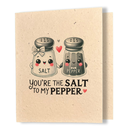 plantable greeting card, natural coloured paper, embedded with wildflower seeds, an image in kawaii style of a salt and pepper shaker holding hands, the sentiment reads, you're the salt to my pepper