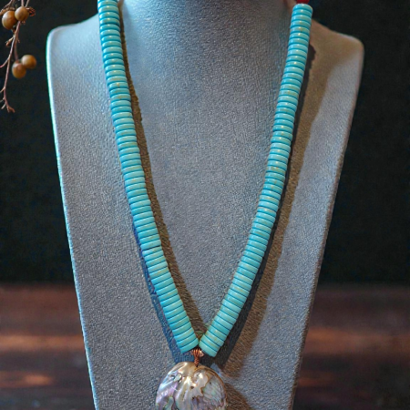 turquoise necklace on jewelry bust