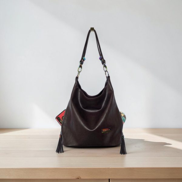 A Slouchy multi pockets eggplant color bag with iridescent hardware and decorative zipper tassels