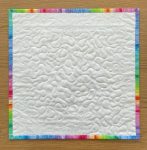 Quilted Colourful Pinwheel Table Topper