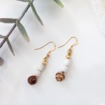 Dangle earrings with matte white magnesite beads, Australian jasper beads, corrugated 14K gold‑filled spacer beads, finished on 14K gold‑filled hooks.