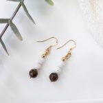 Dangle earrings with African opal beads, matte magnesite accents, 14K gold‑filled spacer beads, and 14K gold hooks.