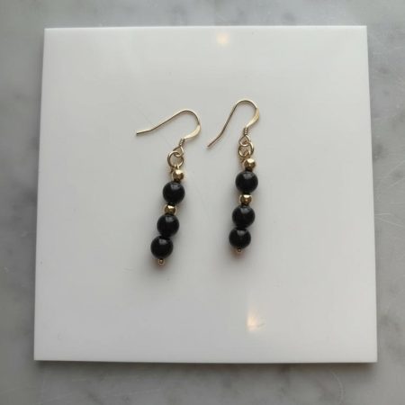 Dangle earrings with golden obsidian beads, 14K gold spacer beads, and 14K gold hooks.